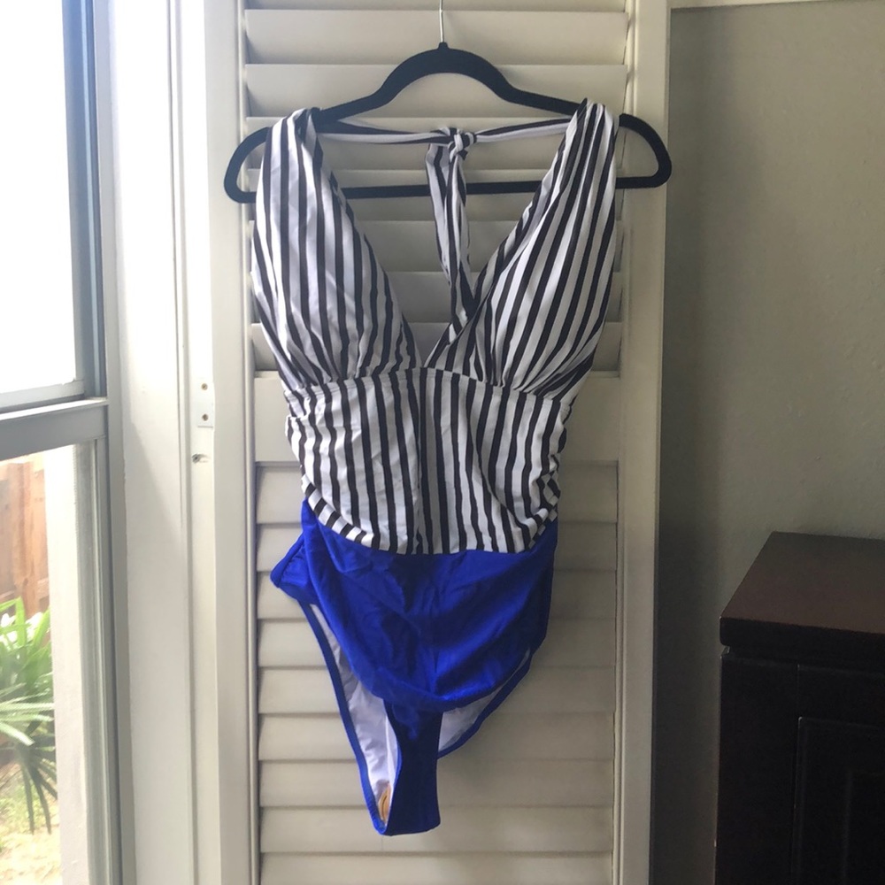 All the retro feels! One piece suit with low back!